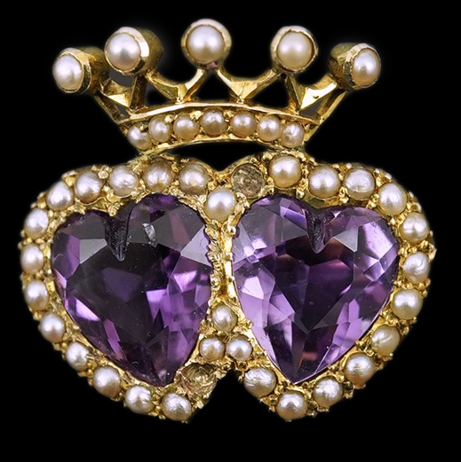 A late Victorian 9ct gold, two stone heart shaped amethyst and seed pearl cluster set coronet brooch